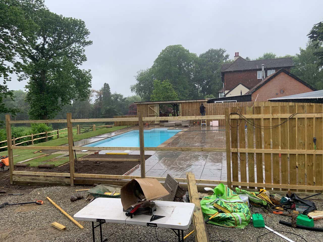 This is a photo of Bespoke custom fencing installed around a swimming pool by Fast Fix Fencing Upwell