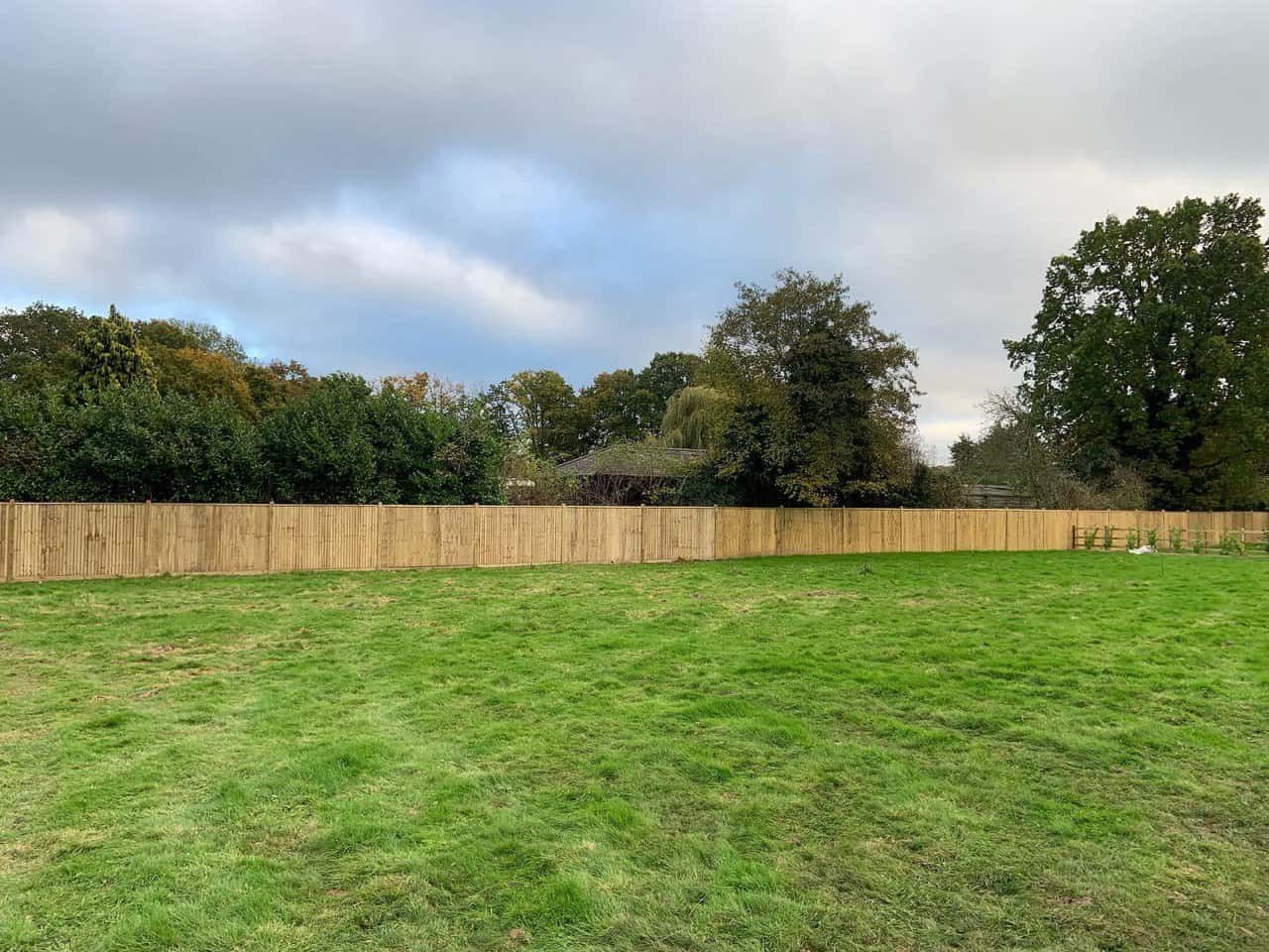 This is a photo of feather edge fencing installed around the edge of a field by Fast Fix Fencing Upwell