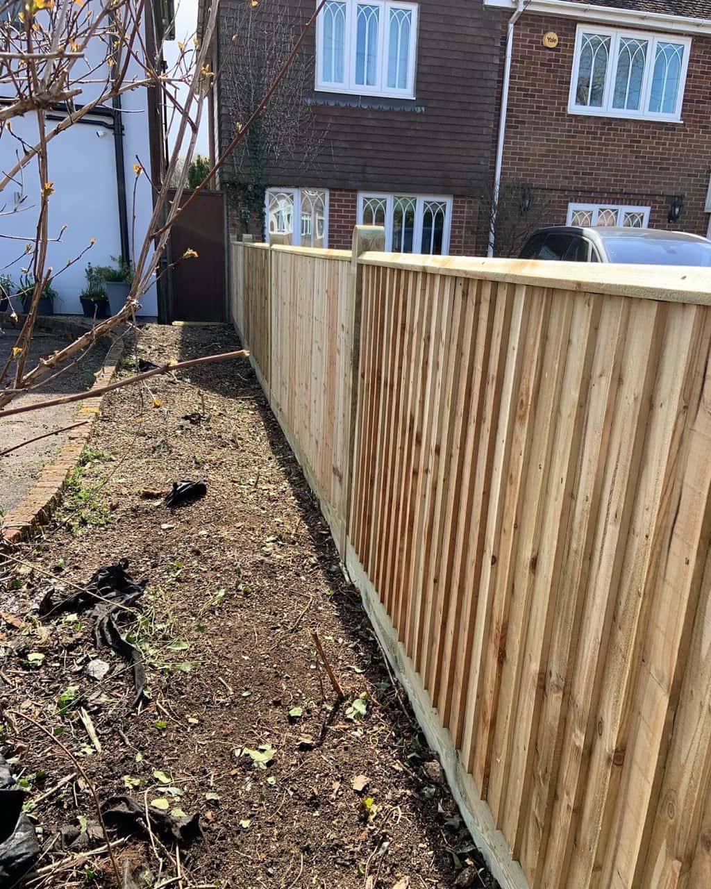 This is a photo of feather edge fencing installed in a residential property by Fast Fix Fencing Upwell