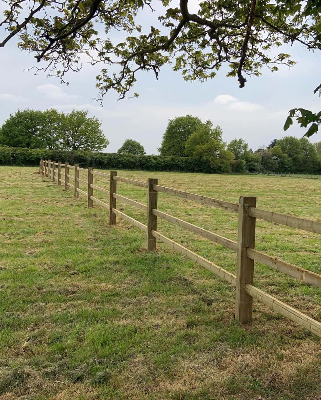 This is a photo of a post and rail fence installed in a field by Fast Fix Fencing Upwell